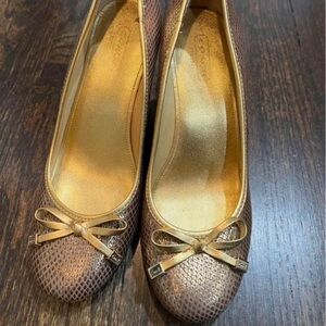Coach women shoes
Closed toe gold leather wedges size 7